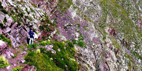 Rocky hillside with lone walker